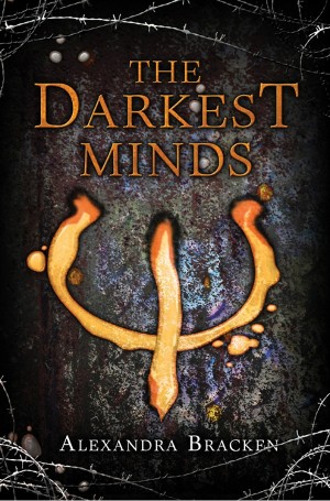 Cover of The Darkest Minds, with a golden trident symbol on a concrete wall surrounded by barbed wire