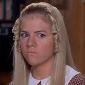 Jan Brady from the Brady Bunch Movies with a sneer on her face