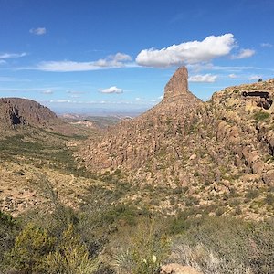 A scenic photo of Weaver's Needle, a rock peak in the Arizona desert