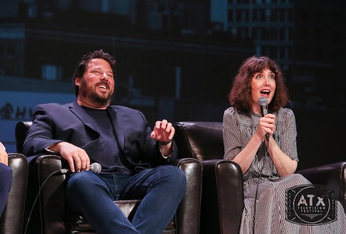 Photo of Greg Grunberg, laughing, while Amanda Foreman makes a shocked face while holding a microphone