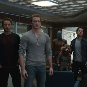 A group of Marvel superheroes stand around looking at the camera