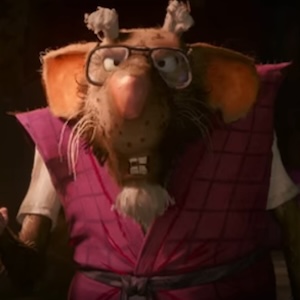 A mutant rat wearing glasses and a reddish vest