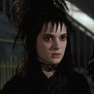 Screenshot from Beetlejuice of Winona Ryder as Lydia Deetz, a pale girl with black hair wearing all black