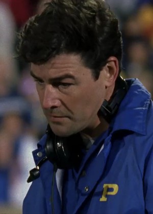 Photo of Coach Taylor, a white man with brown hair, looking defeated