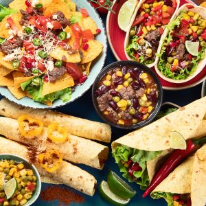 A variety of Mexican dishes like tacos, flautas, etc.