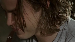 Tim Riggins, with his shaggy brown hair hanging over his face