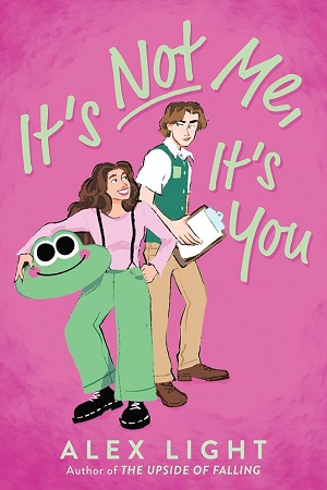 Cover of It's Not Me, It's You, by Alex Light. A teenage girl in a frog costume grins up at a nicely dressed boy.