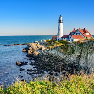 Photo of Portland Headlight Lighthouse in Portland, Maine, on a rocky cliff by the sea