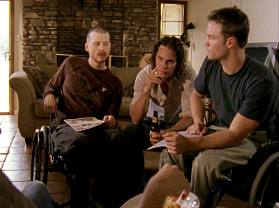 Herc, Riggins and Jason, three cute white guys on Friday Night Lights, sitting in a living room together. Riggins is staring intently off-camera like he's making a point, while Herc and Jason are looking at each other suspiciously.